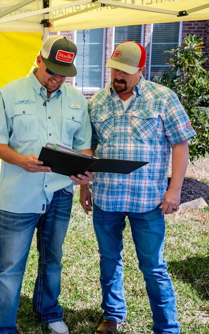 Two Down South team members reviewing paperwork together